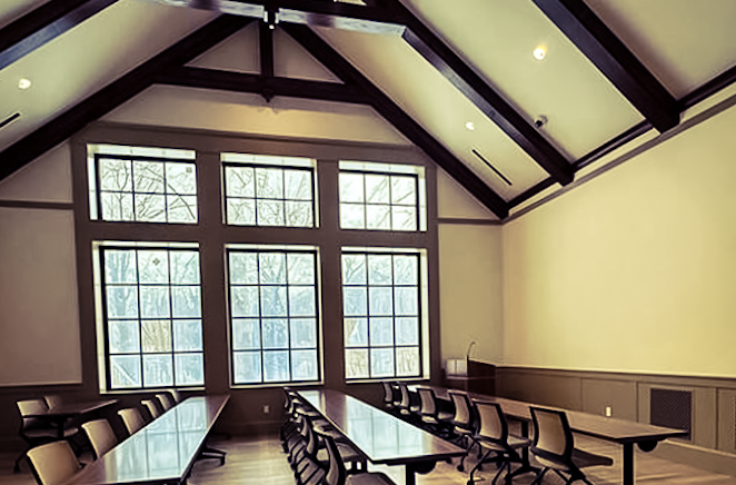 Spacious interior of the HARC physical clarrom for learning featuring modern art and gallery lighting