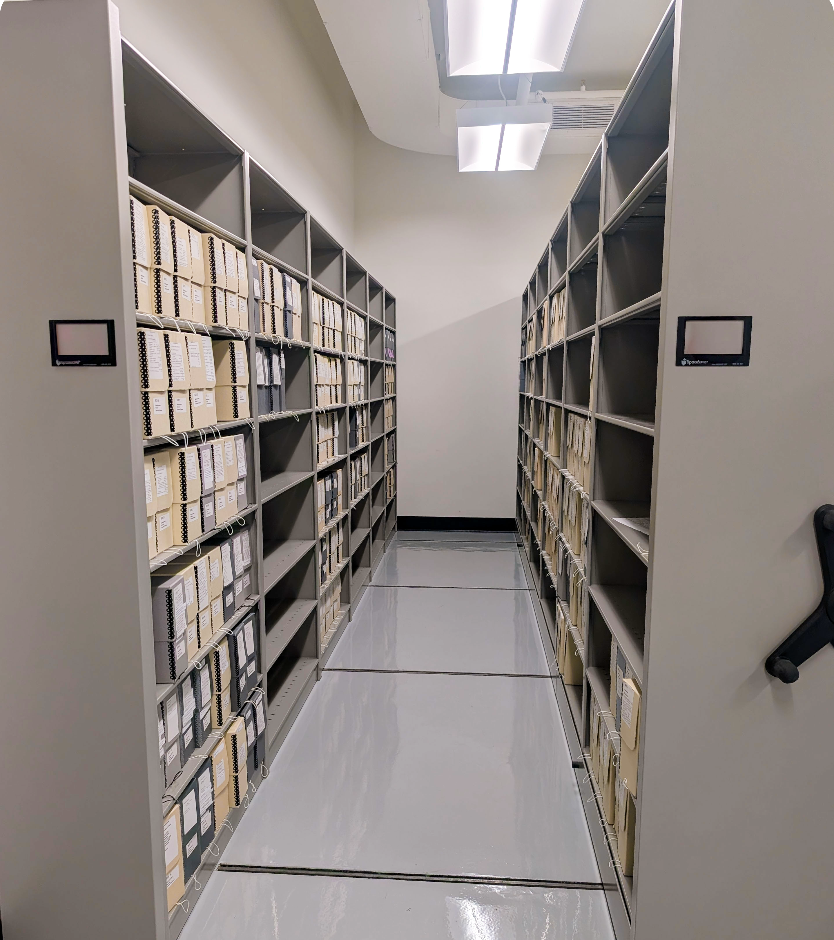 Rolling compact shelving units inside the HARC archives
